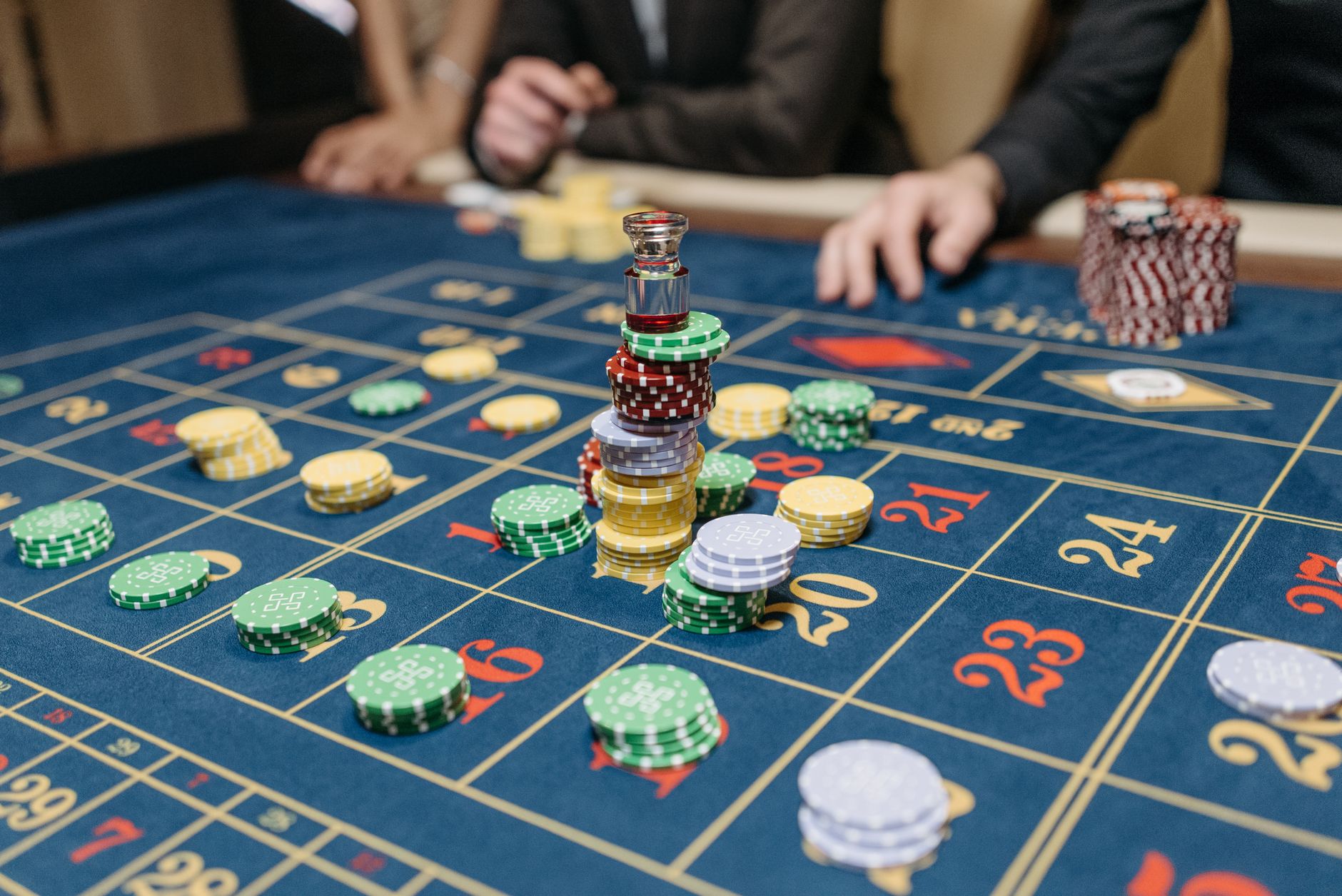 A casino table featuring stacked gaming chips and a roulette layout, suggesting gameplay. — UEFA Competitions Showcasing Elit